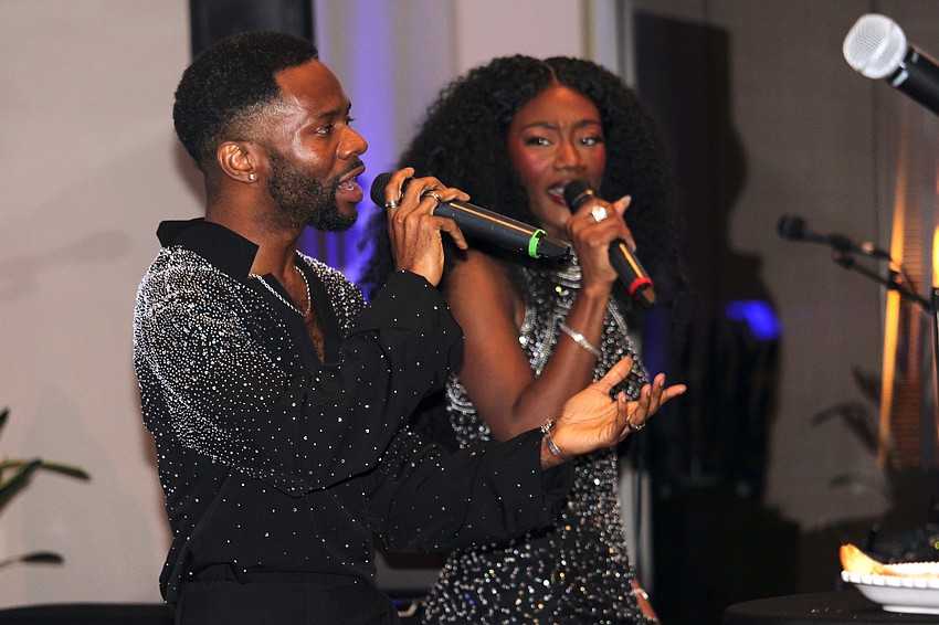 Raleigh Mosely II and Jazzmin Carson, members of the Westcoast Black Theatre Troupe, sing at the gala.