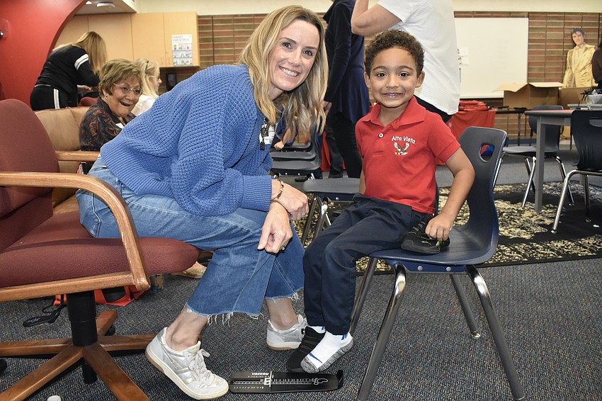Tina Russell poses with Pre-K student Amari Price.