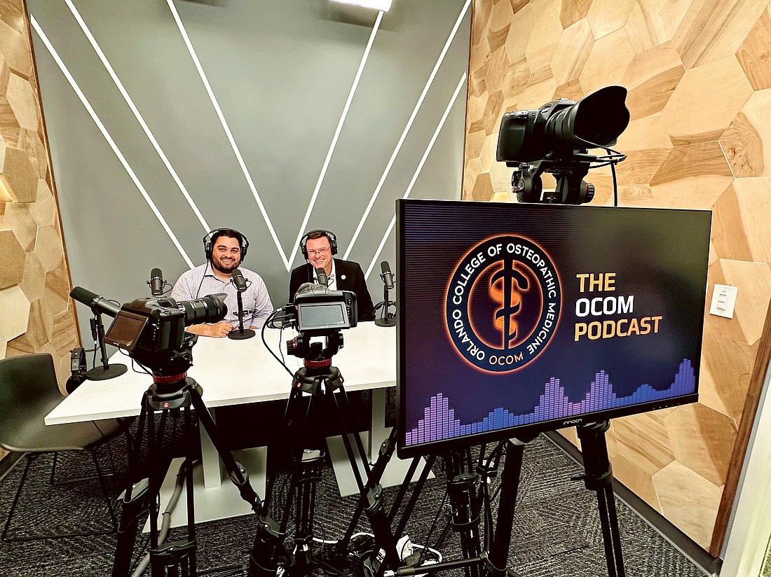 OCOM Media Engineer/IT Specialist Edwin Gonzalez, left, and Dean and Chief Academic Officer Dr. Robert Hasty work together to produce the podcast.