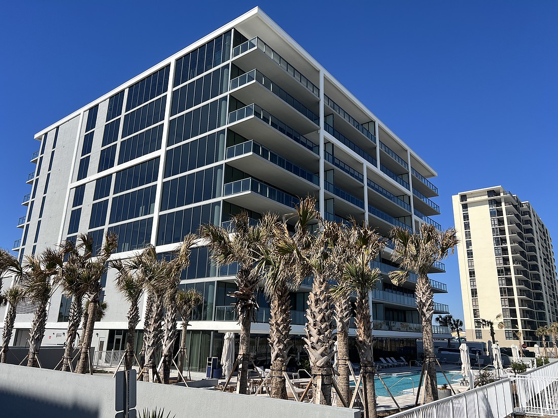 Oceanfront condominium unit with community amenities featuring fitness center, outdoor bar, game room, pool and parking garage.