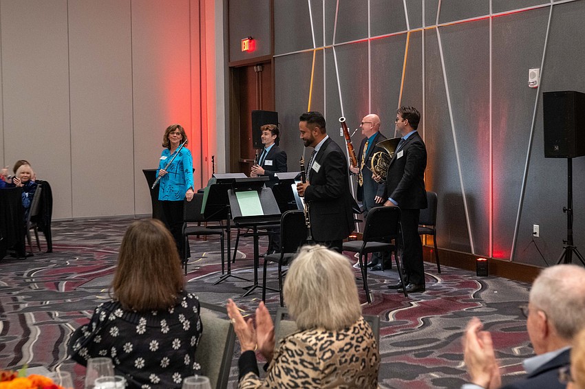 The Sarasota Orchestra Wind Quintet takes a bow after performing prior to dinner.