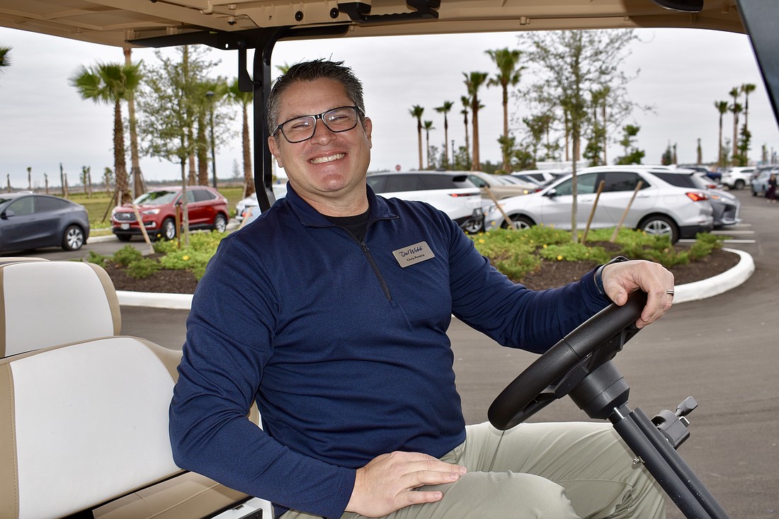 Chris Pereira, director of land planning and entitlement at Pulte Homes, has to shuttle guests back and forth from their cars because the parking lot is full.