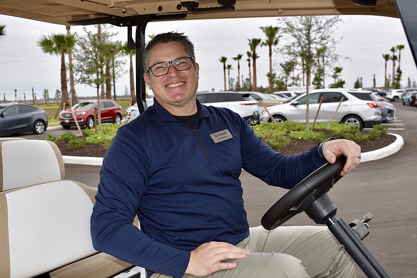 Chris Pereira, director of land planning and entitlement at Pulte Homes, has to shuttle guests back and forth from their cars because the parking lot is full.