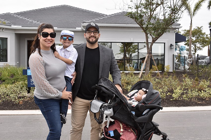 Maria Noelis Belgrave Rosario is a broker with B1 Realty. Since it's Saturday, her husband Roger Rosario, son Benjamin and daughter Amelia joined her for a tour of the new community.