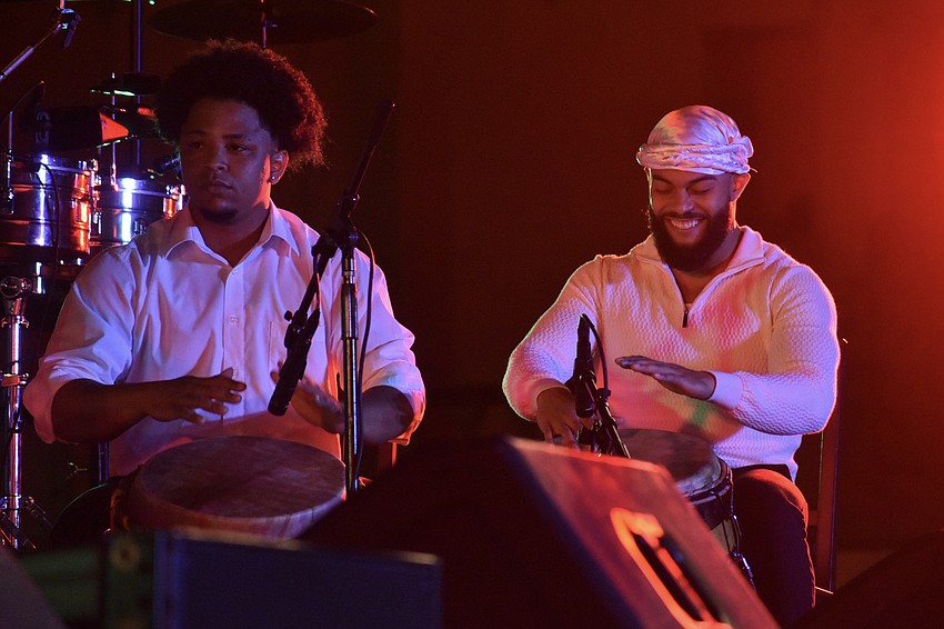 Victor Quiñonez and Ayai Ortiz play with Bomba Yemayá.