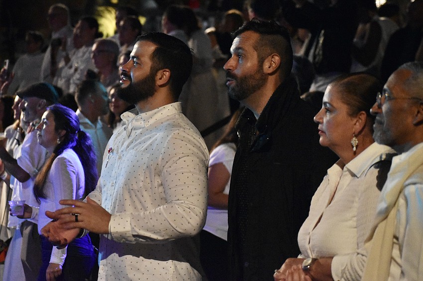 Christian and Alex Sarruff and Matilde and José Rodriguez enjoy the music.