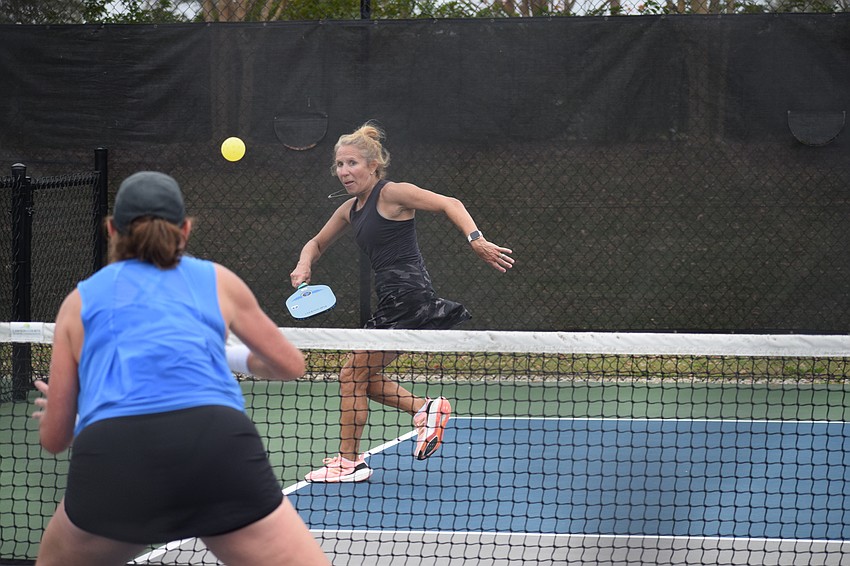 Patti Cron O'Neill raced to the sideline to return a shot to Tammy Senousy in one of the most competitive matches of the afternoon in the Casey Cares pickleball tournament on Feb. 1.