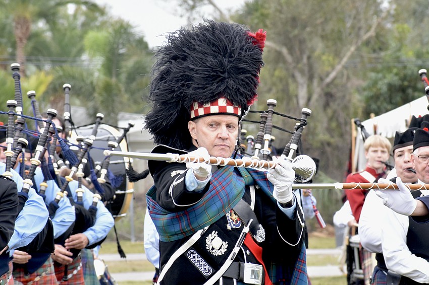 Senior Drum Major Steve McClure marches in the opening ceremony.