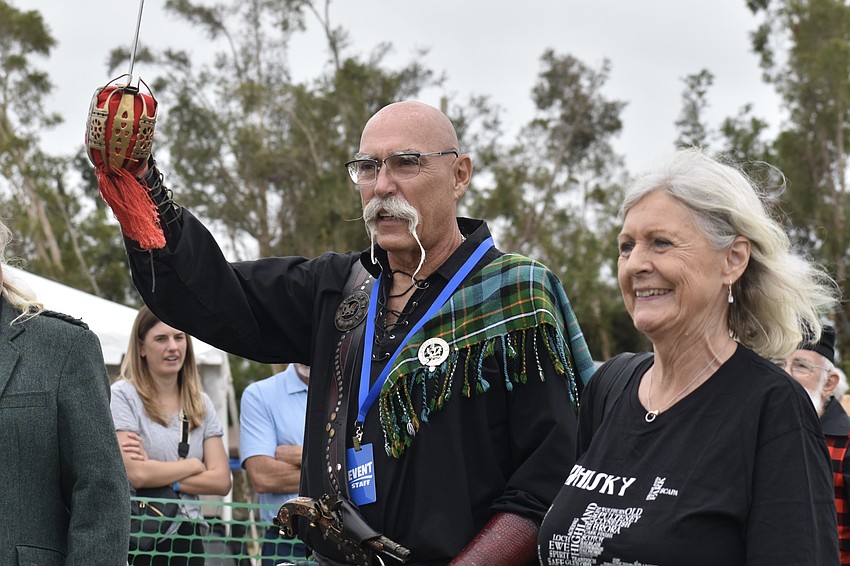 John Gale and Mary Mullen walk in the opening ceremony.