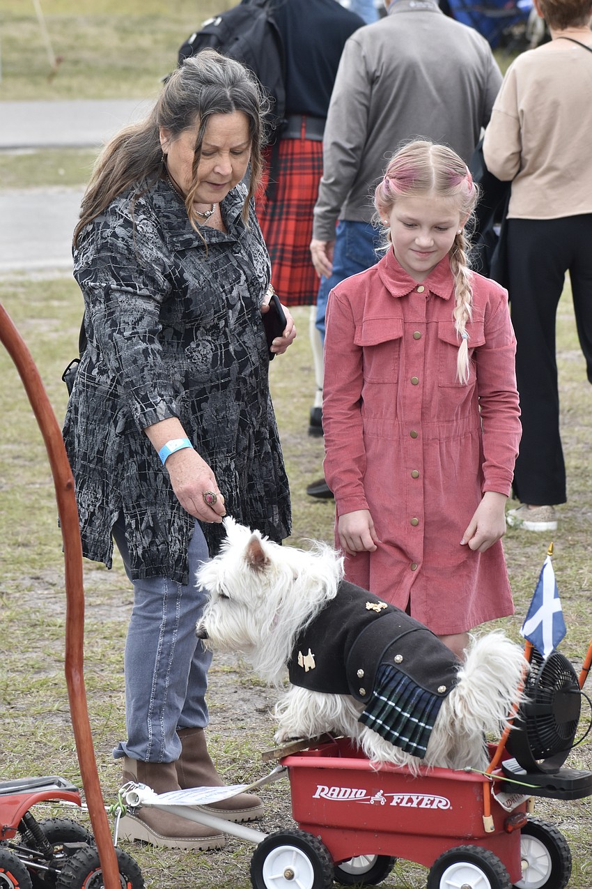 Denise Inosencio and her grandaughter Sophia Douglas, 9, pet Kaylee.