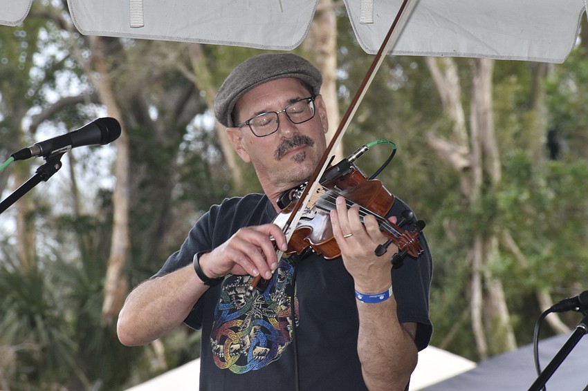 Bryan Klopfenstein of Drunken Shrubbery plays the fiddle.