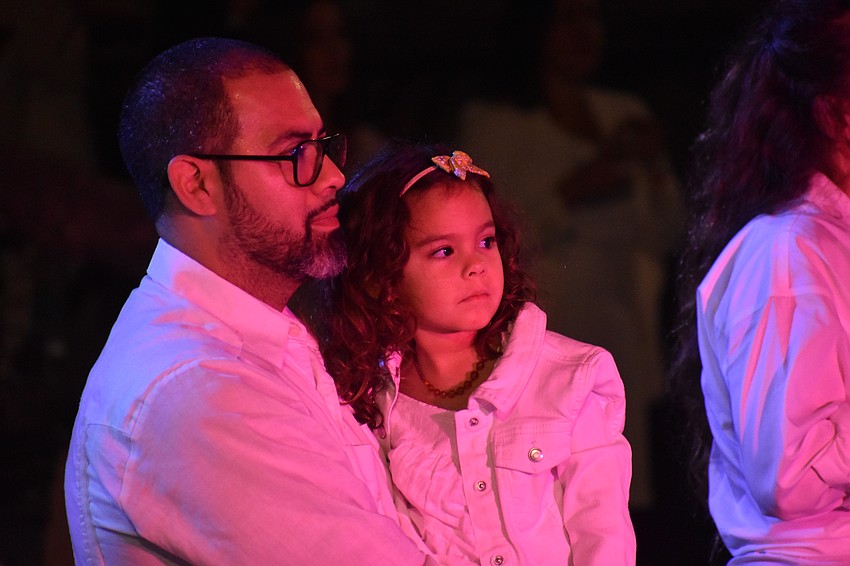 Randic Morillo and Uma Morillo, 4 watch Bomba Yemayá perform.