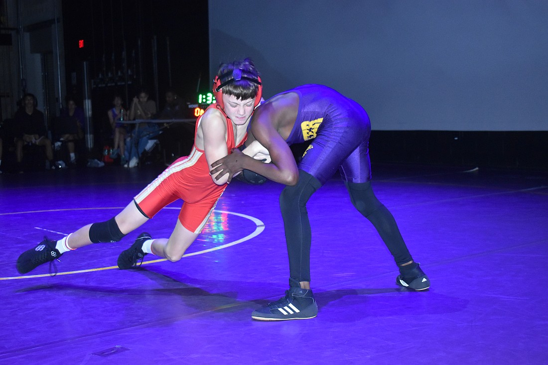 Cardinal Mooney's Tommy Bury wrestles in the 106-pound class at Cardinal Mooney's meet with Booker High in Booker High's auditorium on Jan. 30. Bury won the match by fall.