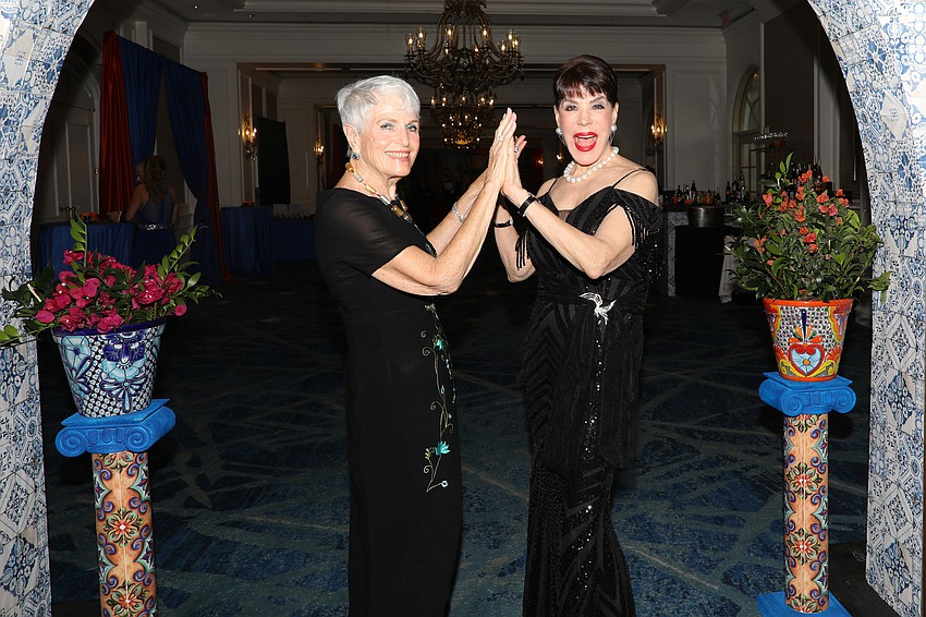 Co-chairs Edie Chaifetz and Tamara Jacobs high-five over a job well done.