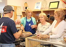 Val Evanko, Joyce Mazurek and Dona Petruccelli run the counter at the Lord's Warehouse reopening.