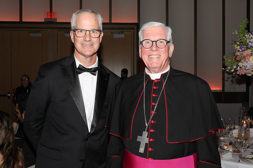 Catholic Charities CEO Chris Root and Bishop Frank Dewane