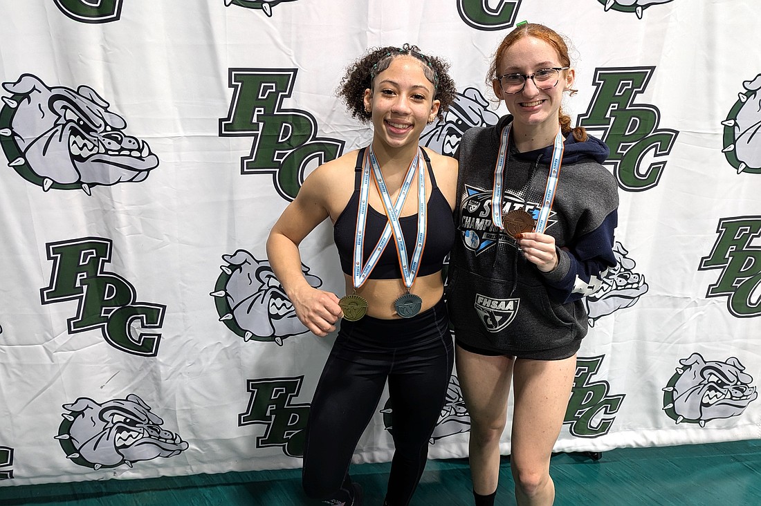 FPC's Nya Williams (left) and Madeline Brinker are both headed back to the state weightlifting championships. Photo by Brent Woronoff