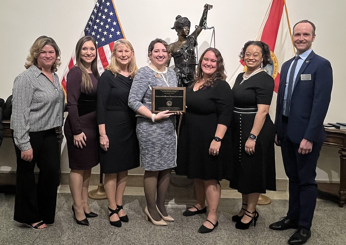 From left, Krizia Gonzalez-Colon, Three Rivers Legal Services pro bono coordinator; Sarah Morris, Jacksonville Women Lawyers Association secretary; Alice Morris, JWLA pro bono liaison; Brittany Ford, JWLA president; Cyndy Trimmer, JWLA 2020-21 president; Kimberly Woods, JWLA 2023-24 president; and Aaron Irving, Jacksonville Area Legal Aid pro bono and low bono director.