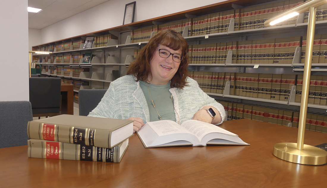 Assistant Professor of Law and Director of Law Library Colleen Skinner in the library at the Jacksonville University College of Law.