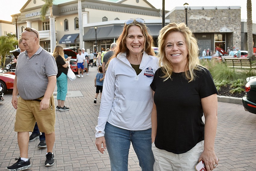 Lakewood Ranch's Deb Meeks and Jill Carpenter take a walk through the car show after having dinner at Casa Maya.