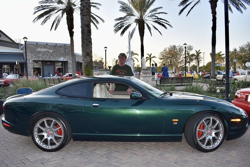 Braden Woods resident Gary Hatfield stands behind his 2005 Jaguar XKR.
