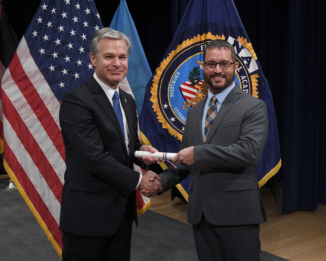 Deputy Chief Scott Nylander, right, graduated from the FBI National Academy in December.