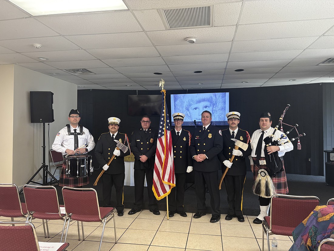 Retired Flagler Beach Fire Chief Robert Pace (third from left) is honored during a Jan. 31 ceremony. Courtesy photo