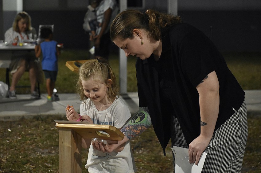 6th Grader Juniper Buretz and her mom Lindsay Buretz perform an activity.