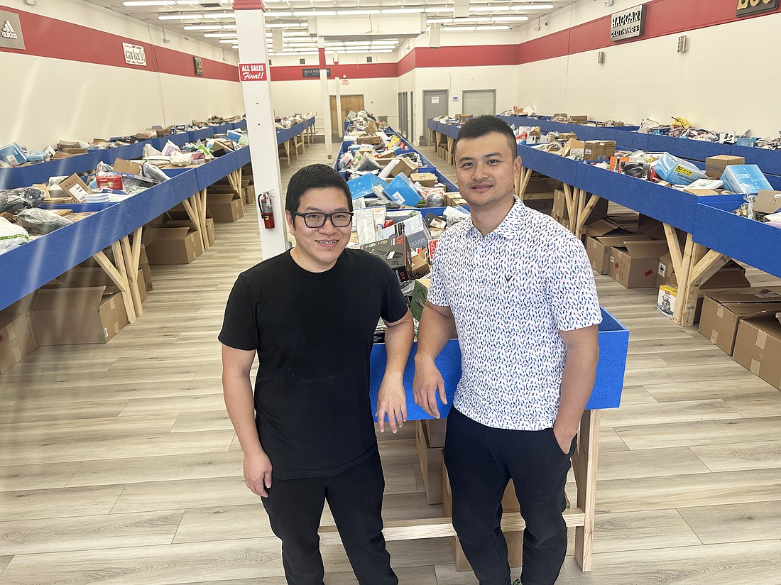 Ken Zhang, left, is the manager and Brian Liu is the owner of Deal Diggers Bin Store at 7538 Beach Blvd. next to RD International Market in the Beach Boulevard Shopping Center.