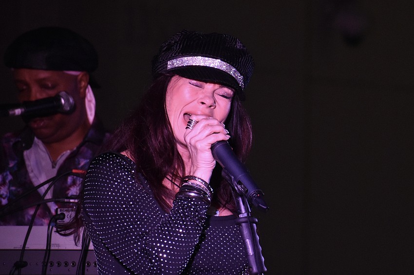 K-Luv, of K-Luv and the United Funk Foundation, performs on stage.