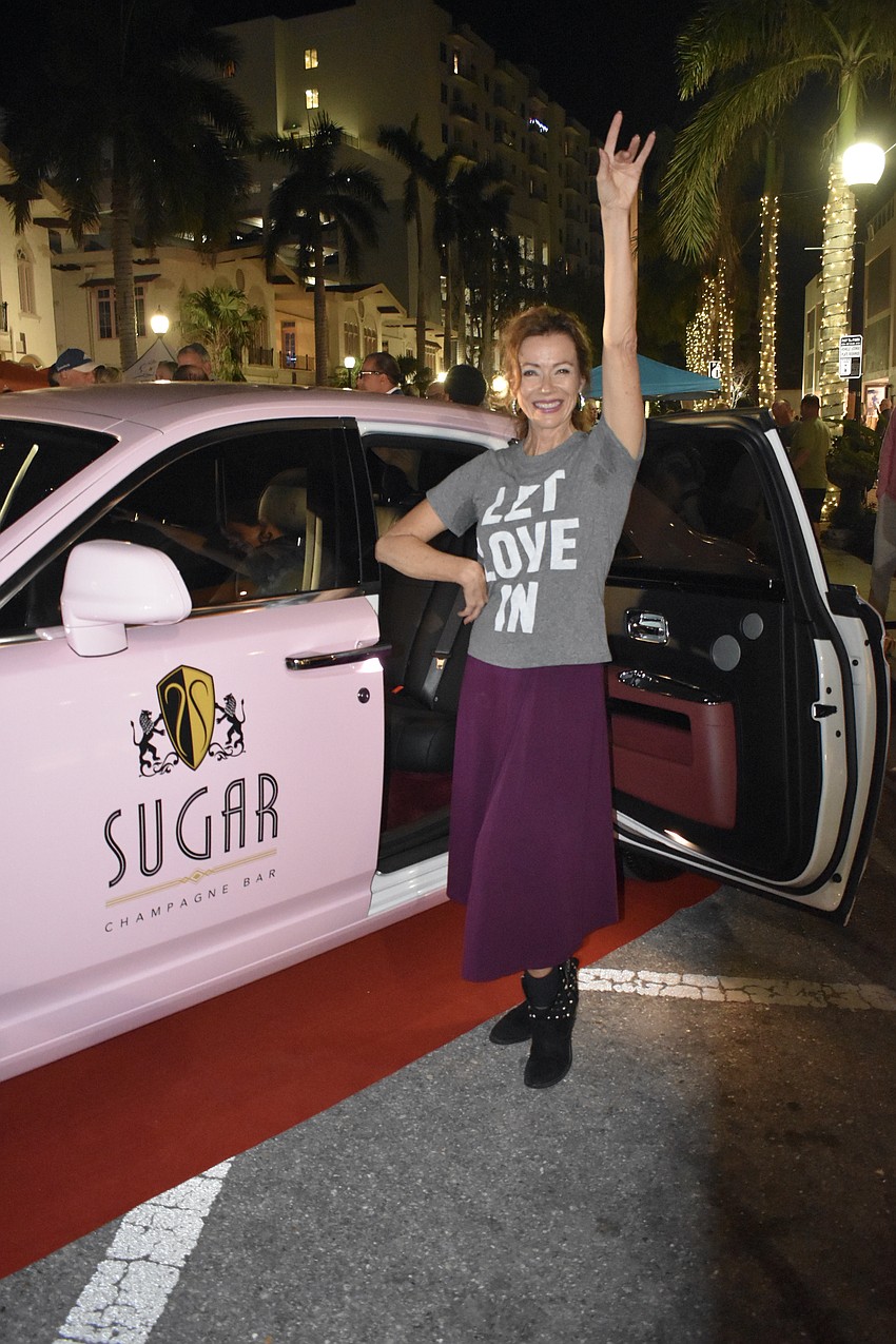 Ana Munroe poses with the Sugar Champagne Bar Rolls-Royce.