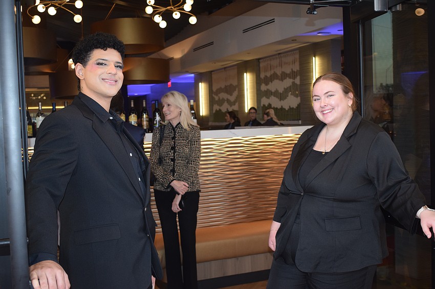 Greeters Ethan McNary and Sarah Williamson welcomed guests to Fleming's Prime Steakhouse and Wine Bar at UTC during a soft opening event Saturday.