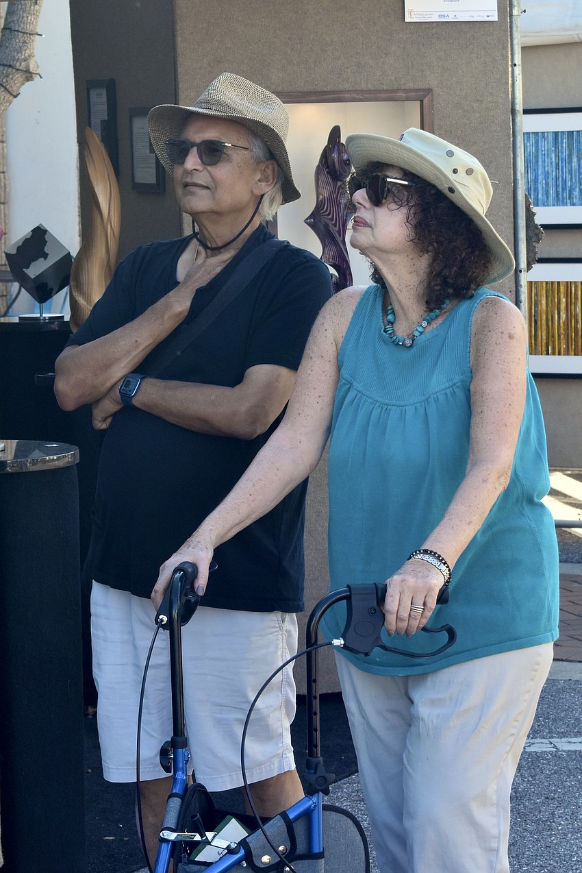 Dilip and Estelle Mathur admire the artwork.