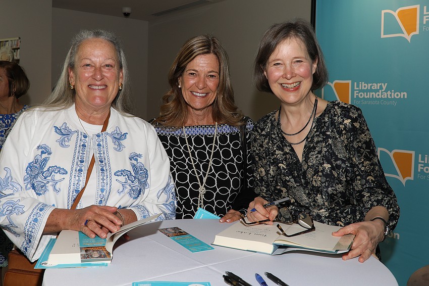 Tris Downer and Claudia Cardillo have their books autographed by author Ann Patchett.