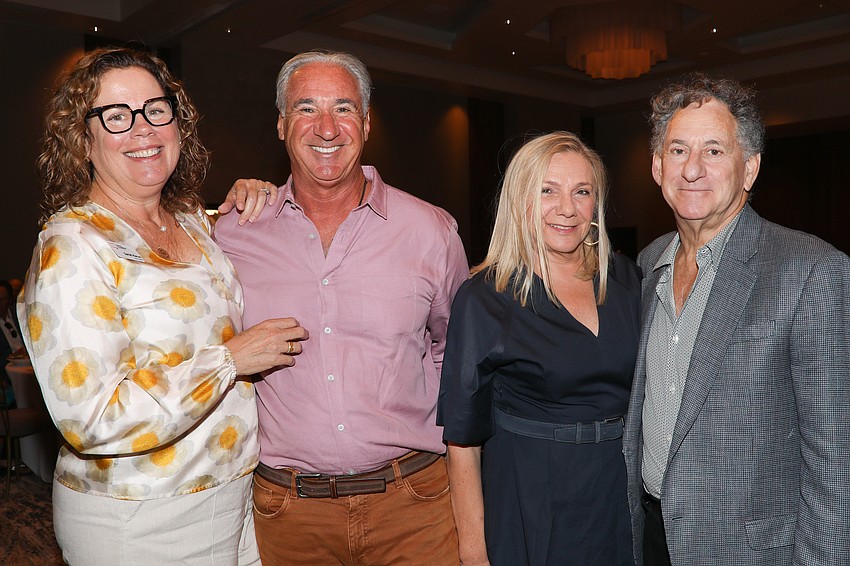 Library Foundation Chair Sarah Karon with husband, Paul, and Mira Akins and Jack Paley