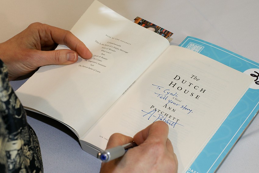 Award winning author Ann Patchett signs a copy of her book The Dutch House for Cyndi Nelson.