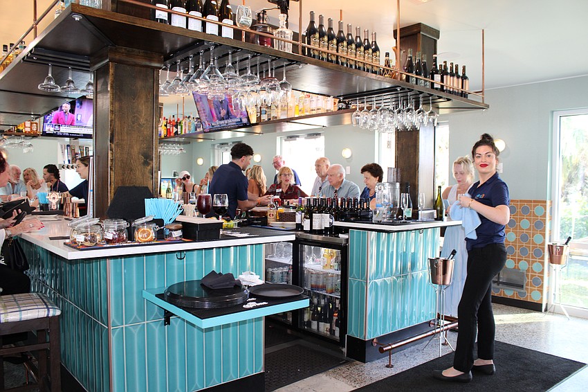 The restaurant includes dining and bar seating.