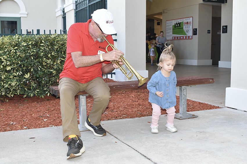 John Castleman of the Venice Symphony Orchestra plays trumpet for Audrey Locken, 1.