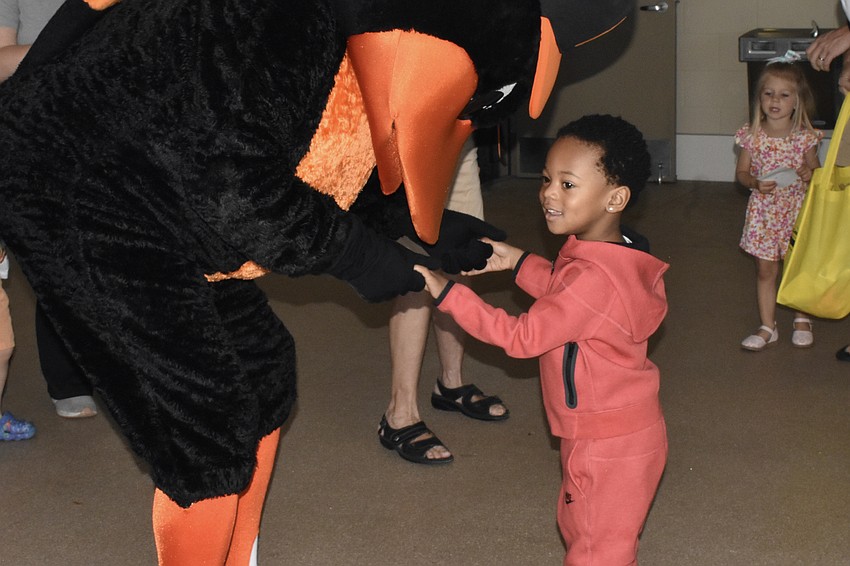 Nasir Loftis, 3, meets The Oriole Bird.