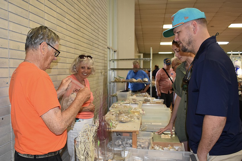 Duane Kauffman and Pat Weaver make a sale to Kenan Fleck and Chad Hollifield.