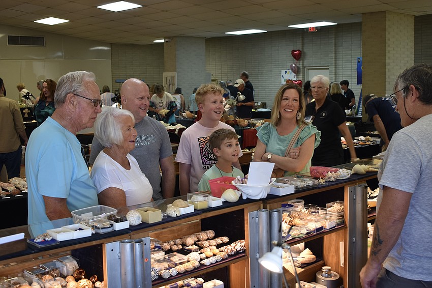 Wayne and Bonnie Gerst, Andy White, Dylan White, 13, Jordan White, 10 and Christin White talk with Mark Geiser.