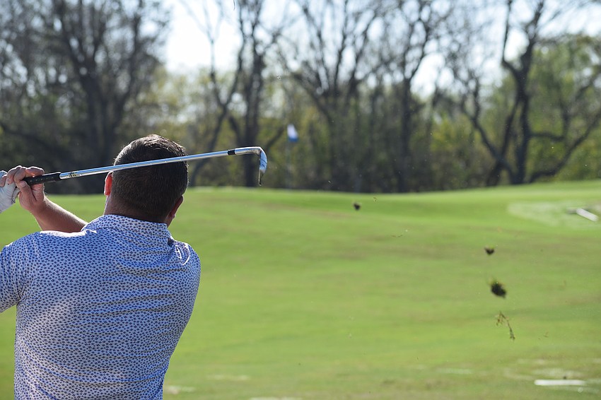 Jason Mitchell goes for the green during the Lakewood Ranch Community Foundation's Charity Golf Scramble.