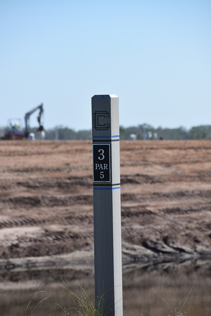 Long stretches of dirt serves as the backdrop for many holes at Calusa Country Club, which is open to the public, but still not fully completed.