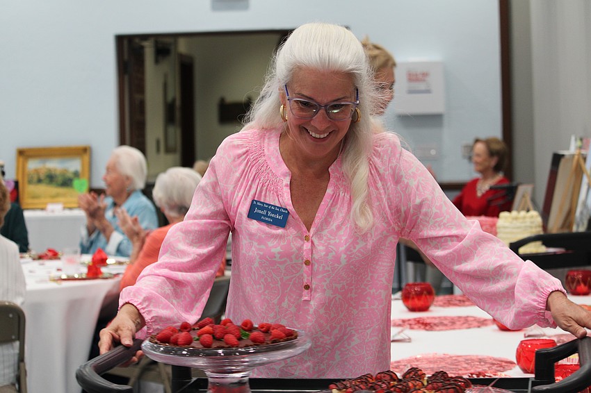 Jonell Yoeckel helps dish out desserts.