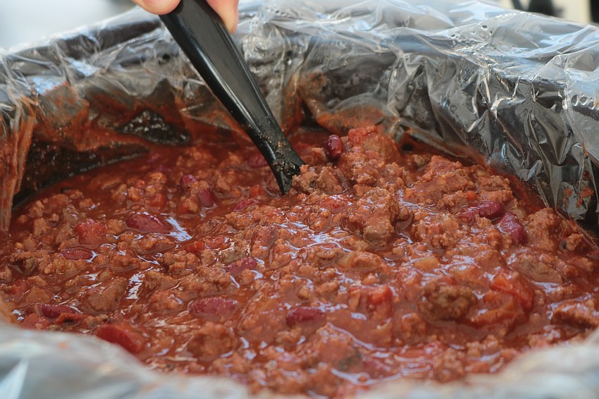 Jon Mast’s Buck Shot Chili gets a stir at the Suncoast Builder’s Association’s third annual Chili Cook-off Feb. 13.