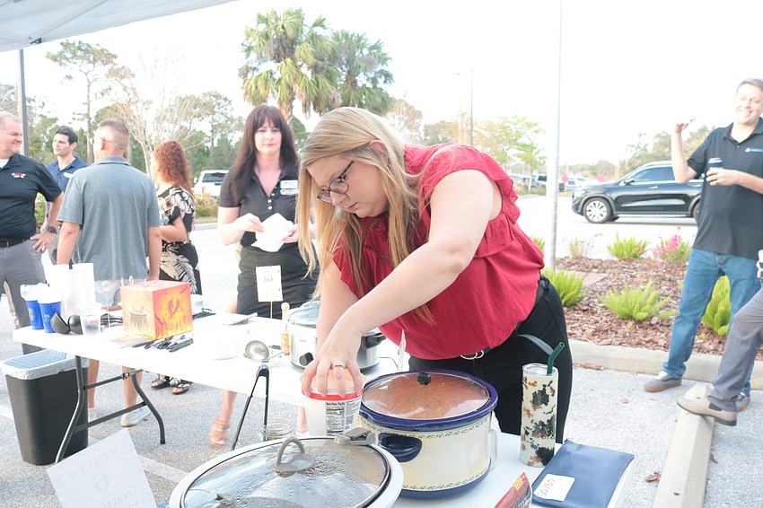 Amber Elsenheimer prepares her Venison 5-Alarm Chili with Cowboy Candy and Chalula Cream.