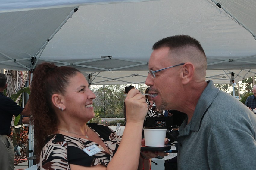 Kim Boynton feeds some gumbo to Davis Ryder at the Suncoast Builder’s Association’s third annual Chili Cook-off Feb. 13.