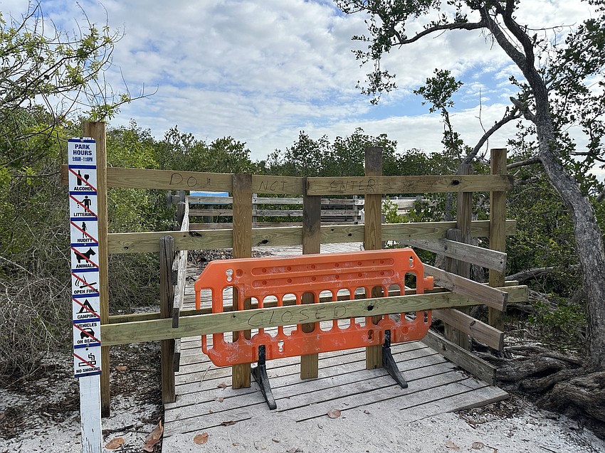 The entrance to the Quick Point Nature Preserve boardwalk is closed off to prohibit public use.