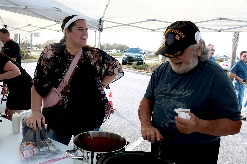 Elizabeth Booth and Carl Chitjian talk as they prepare their entries in the Suncoast Builder’s Association’s third annual Chili Cook-off Feb. 13.