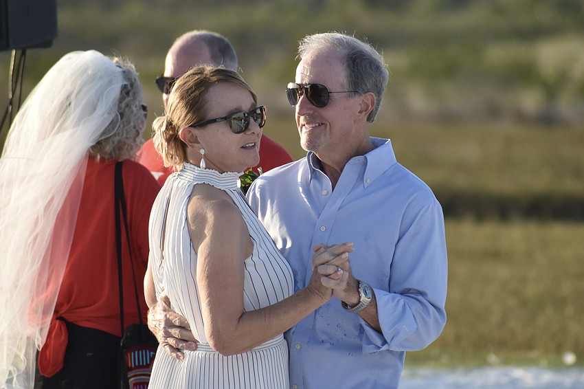 Lynn and Scott Johnson of Lakewood Ranch dance on the beach. They have been married 36 years.